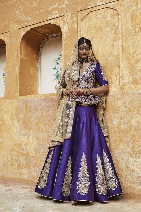 Sangeet Lehengas - Deep Purple Silk Lehenga | WedMeGood | Gold Embroidered Silk Purple Peplum Blouse, Silk Lehenga with Gold Dabka Motifs, Gold Net Dupatta Outfit by: Sue Mue #wedmegood #lehenga #indianbride #indianwedding #bridal #purple Lehenga Designs Purple, Purple Bride Dress, Peplum Lehenga, Purple Lehenga, Designer Bridal Lehenga Choli, Fusion Wear, Lehenga Jewellery, Wedding Purple, Lehenga Gown