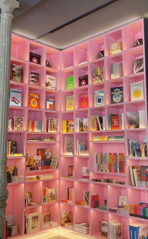 pink book shelf wall decor cubby cute Pink Shelves Bookshelves, Pink Maximalism Bedroom, Girly Home Library, Girly Modern Living Room, Girly Library Room, Office Maximalist, Barbie Office Decor, Kaws Living Room Decor, Pink Aesthetic Office