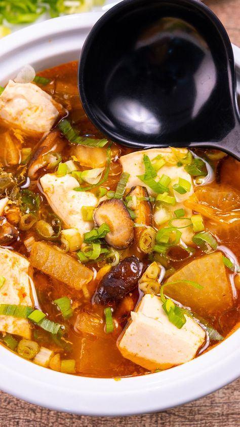 Korean tofu soup, also known as soondubu jjigae, is a classic Korean soup that comes together in less than 30-minutes and packs a punch of heat. Using soft or silken tofu and eggs provides protein, making this a fast and easy weeknight meal loaded with flavor. While the recipe calls for some ingredients that may be a little difficult to find, there are substitutions in the notes that may not be traditional but will still provide delicious results. Tofu And Eggs, Korean Tofu Soup, Korean Soup Recipes, Soondubu Jjigae, Jjigae Recipe, Korean Tofu, Korean Dumplings, Korean Soup, Mushroom Vegetable