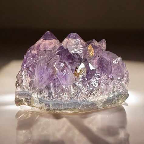 This extraordinary Amethyst Cathedral Cluster, boasting a Rutile Star, Record Keeper, and Hematite Inclusions, shines with remarkable clarity, embodying the potential for profound growth and transformation. At its heart, the rare Rutile Star radiates an inspiring presence. 2.25"x 0.5"x1.5" 3.5 oz Amethyst Cathedral, Amethyst, Stars