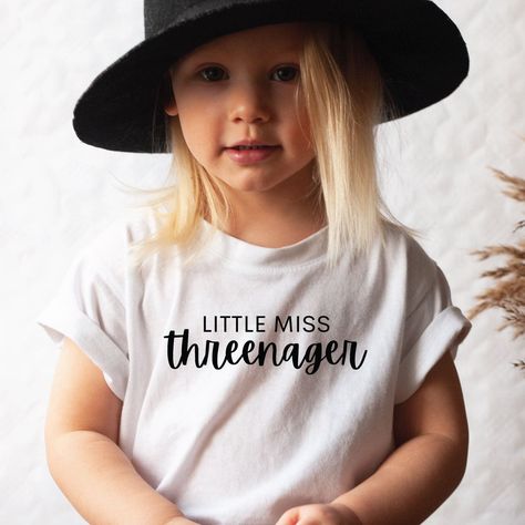 "Welcome to my shop! Grab our Threenager Tshirt, Three Year Old Shirt, Little Miss Threenager, Threenager Toddler Girl Tee, Shirt for Three year old, Third Birthday shirt today!  For more designs visit: https://www.etsy.com/shop/AdamoProductsLLC?section_id=32968674 This shirt is printed with ink, not vinyl! Our designs are printed using special ink that gets absorbed into the fibers of the garment. This is known as \"Direct To Garment\" printing, and makes the design more permanent than other pr Age Three Birthday Themes, Threenager Birthday Shirt, Toddler Girl Shirt Ideas, Birthday Tshirt Ideas Kids, Little Miss Threenager Birthday Ideas, Three Year Old Birthday Party Theme, Three Year Old Birthday Party Girl, 3rd Birthday Shirt Girl, 3rd Birthday Photoshoot