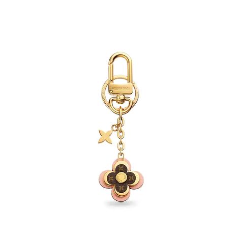 Women's Luxury Key Holders, Charms & More - Louis Vuitton ® Logo Luxe, Louis Vuitton Luggage, Louis Vuitton Official Website, Key Holders, Louis Vuitton Accessories, Purse Charms, Blooming Flowers, Vuitton Bag, Small Leather Goods