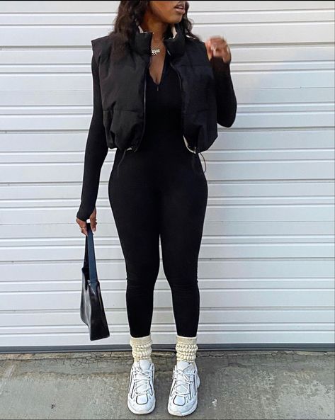 Black Gillet Outfits Aesthetic, Bodysuit Vest Outfit, Baddie Puffer Vest Outfits, Jumpsuit Vest Outfit, How To Style Full Bodysuit Outfit, Black Full Bodysuit Outfit Winter, Catsuit Outfit Casual, Black Body Warmer Outfit Women, How To Style A Catsuit