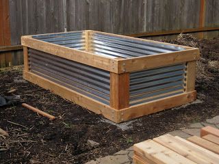 raised bed made of cedar and corrugated metal roofing. Raised Garden Bed Plans, Raised Vegetable Gardens, Building Raised Garden Beds, Building A Raised Garden, Diy Raised Garden, Raised Garden Beds Diy, Raised Planter, Higher Ground, Corrugated Metal