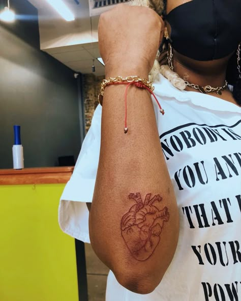 Intellectual Tattoos Ideas, Patchwork Tattoo Ideas Black Women, Red Ink Tattoos Men Black, Heart Tattoo On Face Black Women, Rockstar Tattoo Ideas, Black Women Red Tattoo, Red Tattoos For Women Dark Skin, Tattoo On Black Skin, Red Tattoos On Dark Skin