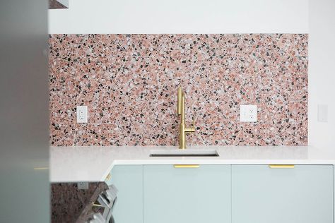 A small kitchen doesn't have to be boring! In this beachside condo renovation, Dwell October combined color and pattern to create a fun, modern kitchen featuring Semihandmade Agave Slab cabinets, pink terrazzo-inspired backsplash tiles, and gold hardware. Read on for sources and more details. Terrazo Kitchen Countertops, Small Enclosed Kitchen, Pink Terrazzo Floor, Terrazzo Counter, Terrazzo Countertop, Cafe Bar Interior, Enclosed Kitchen, Slab Cabinets, Terrazzo Wall