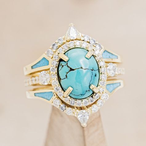 Product Details Ring Style: The "KB" is a halo-style oval turquoise women's engagement ring with diamond accents and "Sama" tracers. Many other center stone options are available upon request. Center Stone: 10x8mm Oval Turquoise Materials: 14K gold engagement ring featuring a turquoise center stone, .64 CTW diamond acc Turquoise Engagement Ring, Turquoise Ring Engagement, Wedding Collage, Contour Band, Raw Turquoise, Staghead Designs, Fancy Rings, Mens Engagement, Halo Style