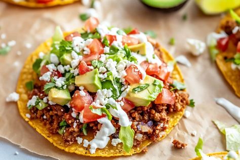 Easy Mexican Tostadas Ground Beef Refried Beans, Mexican Tostadas, Beef Tostadas, Tostada Recipes, Tomato Cheese, Mexican Crema, Green Salsa, Pickled Veggies, Easy Mexican