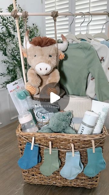 Kellie Atkinson on Instagram: "Baby shower gift basket 🧸🍼 🧺  Comment “Baby” for links sent to you inbox 💙🔗  #asmr #baby #babyshower #babyboy #babyshowergift #babyshowergiftideas #giftbasket" Baby Basket Hanging Clothes, Baby Clothing Rack Gift Basket, Baby Basket With Hanging Clothes, Baby Shower Crate Gift Basket Boy, Baby Gift Basket With Hanging Clothes, Baby Shower Gifts Boy Basket, Girl Baby Shower Basket Ideas, Baby Shower Baskets Boy, Baby Book Gift Basket