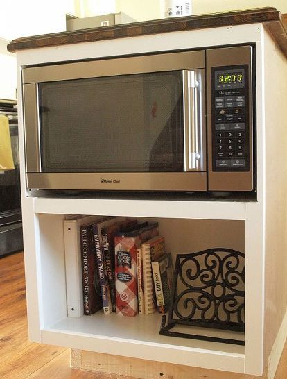 We wanted our microwave to be out of sight so we built a custom under counter cabinet for it with extra roof for cook book storage. We did this part of a large kitchen renovation but can easily be added to an exiting island as well. You can see all the details on this project plus more on our kitchen renovation at http://simplyswider.com Large Kitchen Renovation, Microwave Wall Mount, Counter Microwave, Under Counter Microwave, Diy Kitchen Cabinets Build, Cabinet Microwave, Pallet Deck Diy, Cookbook Storage, Build Dream Home