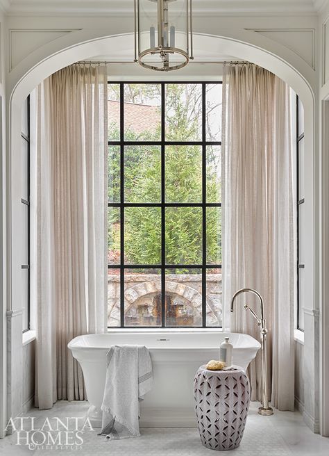 Interior Design: Melanie Milner and Katie Moorhouse of Design Atlelier - Photography: Emily Followill - bathroom - bathroom design - bathroom mirror - bathroom tile - bathroom decor - arch - freestanding tub -Southern Home with Plenty of Style Atlanta Homes And Lifestyles, Porch Fireplace, Shingle Style Homes, Design Atelier, Southern Grace, Relaxing Bedroom, Elegant Dining Room, Atlanta Homes, Classic Architecture