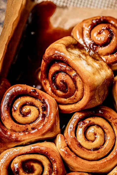 Sticky buns take on a whole new level of fall coziness with the pairing of maple & chai! They're made with an impossibly soft milk bread dough, filled with warm chai spices, and baked in a maple brown sugar goo. As they bake and then cool, the goo turns into a thick caramel-like sauce, giving them their signature sticky effect! Soft Milk Bread, Fall Coziness, Sticky Buns Recipes, Chai Spices, Cardamom Buns, Hot Cross Buns Recipe, Maple Brown, Soft Milk, Milk Bread