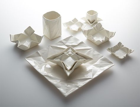 Hamburg-based ceramic artist Angelina Erhorn of Moij Design creates all matter of ceramic dishware that mimics the form of paper origami sheets, both folded and unfolded. Her designs include plates, espresso cups, and vases with delicate creases and occasional stained geometric elements. You can see Origami Sheets, Ceramic Dishware, Origami Shapes, Creative Origami, Cerámica Ideas, Colossal Art, Keramik Design, Modern Crafts, Art Japonais