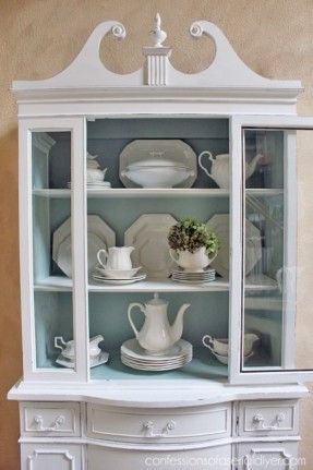 from http://foter.com/explore/white-corner-china-cabinet; I love the arrangement of dishes and tiny bit of greens; Chalk Painted China Cabinet White China Cabinet, Dark Garage, Updating Furniture, White China Cabinets, China Cabinet Makeover, Painted Hutch, Painted China Cabinets, Cabinet Painting, Painted Cabinet