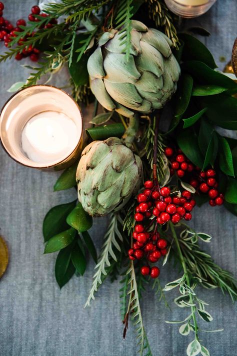 Holiday Floral Centerpiece Arrangement Artichokes, Holly, Pomegranates and Pine. Download this photo by Brooke Lark on Unsplash Elegant Food Presentation, Food Presentation Ideas, Christmas Table Decor Ideas, Sophisticated Food, Table Settings Tips, Elegant Food, Antique Candle Sticks, Fruits Photos, Christmas Table Decor