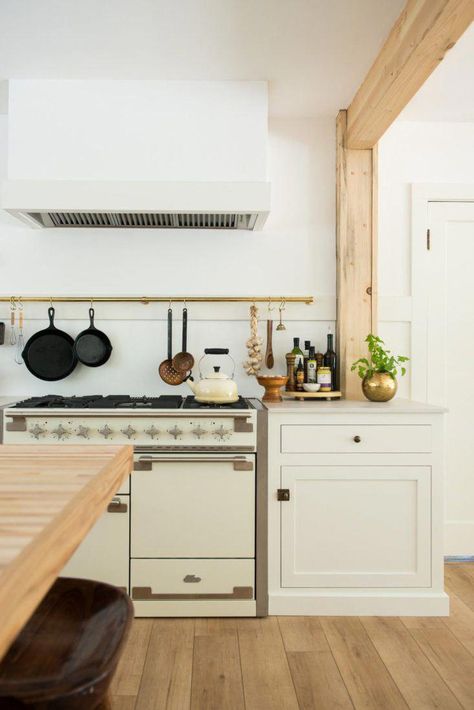 A modern farmhouse kitchen in northern California where clever storage solutions abound. Read more in 7 Storage Ideas to Steal from a Modern Farmhouse-Inspired Kitchen Remodel. Photograph by and courtesy of Jodi Mockabee. #kitchenremodel Cloudburst Concrete, Jodi Mockabee, Kitchen Remodel Trends, Pot Rail, Brass Rail, Barn Remodel, Florida Kitchen, Built In Pantry, Swiss Coffee