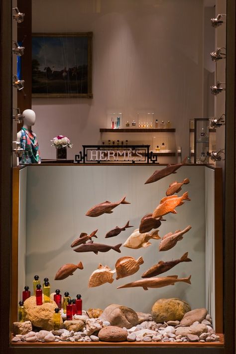 16 wooden fishes for Studio Astolfi, featured in the Hermès spring/summer Chiado, Lisboa, show windows.Photograph- Ricardo Cruz. Hermes Window, Fashion Window Display, Vitrine Design, Summer Window, Visual Merchandising Displays, Store Window Displays, Window Display Design, Retail Windows, Store Windows