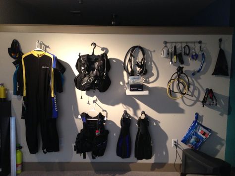 Scuba diving gear storage. On the wall of my living room. Soooo not getting my deposit back on this apartment. Gear Room, Diving Wetsuits, Gopro Surfing, Dive Computers, Scuba Diving Equipment, Gear Storage, Best Scuba Diving, Scuba Diving Gear, Dive Shop