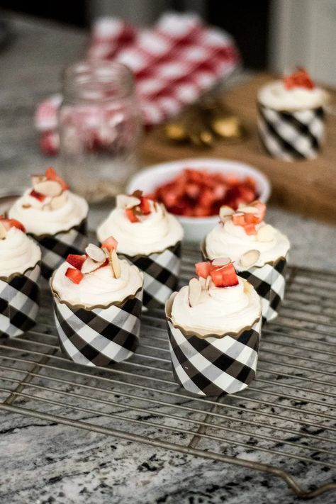 These strawberry rhubarb cupcakes take the cake, and pair perfectly with vanilla almond cream frosting, fresh strawberry topping, and slivered almonds! Strawberry Rhubarb Cupcakes, Roasted Strawberry Cupcakes, Strawberry Basil Cupcakes, Rhubarb Honey Cupcakes, Strawberry Cake Cups Layered, Gourmet Strawberry Cupcakes, Rhubarb Cupcakes, Fresh Strawberry Topping, Strawberry Topping