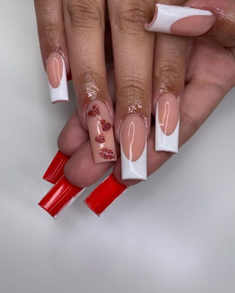 Red bottom nails are a hot new manicure trend, where you paint the underside of your nails red. This style takes after the Christian Louboutin red bottom shoes. Click the article link for more photos and inspiration like this // Photo Credit: Instagram @icedbym // #baddieredbottomnailscoffin #blackredbottomnails #coffinredbottomnails #redbottomnailscoffin #redbottomsnails #rednails #whiteredbottomnails French Tip Nails With Red Bottoms, Loubiton Nails, White Red Bottom Nails, Red Bottom Nails Acrylic, Red Bottoms Nails, Red Bottom Acrylic Nails, Louboutin Nails, Bottom Nails, Red Bottom Nails