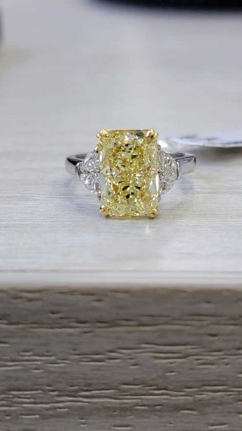 Extremely elongated and gorgeous 5ct Fancy Light Yellow Radiant with an impressive 1.43 ratio Strong color like a Fancy Yellow VVS clarity Set in Platinum and 18kt Yellow Gold with 0.62ct of D VS Half Moons Yellow Topaz Rings, Yellow Canary Diamond Ring, Tiffany Yellow Diamond Ring, Yellow Engagement Ring, Fancy Yellow Engagement Ring, Mom Rings, Canary Diamond Ring, Yellow Topaz Ring, Yellow Gemstone Ring