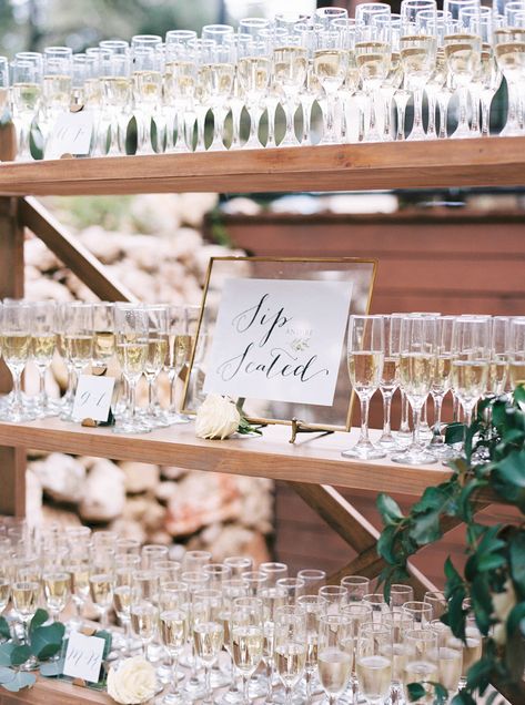 Champagne Table Seating Chart, Champagne Wedding Seating Chart, Champagne Wall Shelf, Champagne Welcome Drink Wedding, Champagne Flute Seating Chart, Champagne Wedding Display, Champagne Before Ceremony, Seating Chart Champagne Glasses, Seating Chart Wedding Drinks