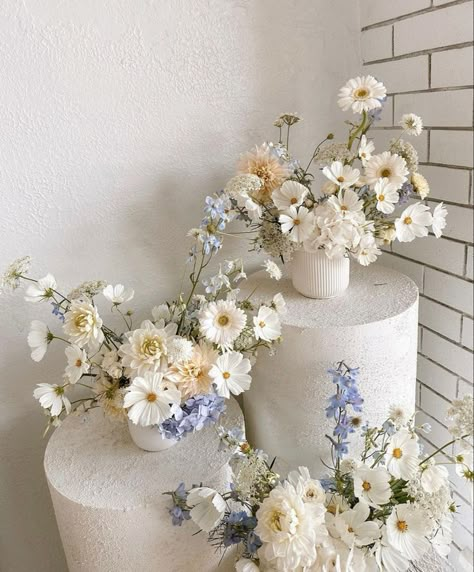 Sep 10, 2023 - This Pin was discovered by Leasie Bettiol. Discover (and save!) your own Pins on Pinterest Coastal Grandma Wedding Flowers, Civil Wedding Flowers, Blue Artificial Flower Arrangements, Summer Blue Wedding Colors, Tent Wedding Flowers, High Low Centerpieces Weddings, Minimal Modern Wedding Dress, White Flowers Aesthetic Wedding, 2024 Wedding Table Trends