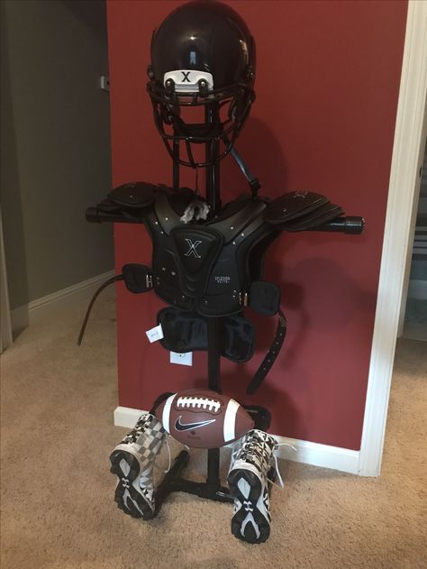 Football helmet and pads holder Football Equipment Stand, Pvc Football Equipment Storage, Football Pads And Helmet Storage, Football Gear Storage, Football Storage, Football Shoulder Pad, Hunter Bedroom, Sports Memorabilia Display, Football Stand