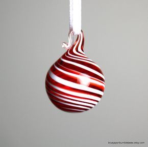 miniature red swirl blown glass ornament. Incredibly tiny at just about 5/8" diameter. These would compliment the smallest of table trees. The artist offers enough variety to fill an entire table tree. Table Tree, Melting Glass, Red Christmas Ornaments, Groovy Christmas, Light Bulb Ornaments, Farmhouse Ornaments, Cottage Grove, Glass Christmas Tree Ornaments, Fire Glass