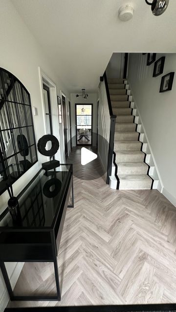 Nicola - The Monochrome Manor on Instagram: "H A L L W A Y   My favourite transformation, our hallway!   Carpet & flooring - Carpet Connection (Ordered/fitted) Carpet - Primo Grande in almond mousse by  STS Flooring  LVT Flooring - Inspiration in English Oak Grey Beige, Tarkett Glass door - Leader Doors Ceiling light - B&Q Prints - The House Outfit Black paint (doors & banister) - Loof, Frenchic  #bellway #bellwayhomes #bellwaynewbuild #bellwayhomesnewbuild #bellwayhome #newhouse #newhome #newbuildhome #housebuilding #house #homeaccounts #homeaccountuk #homeaccount  #diyinteriordecorating #diyhomedecor #homesofinsta #newbuildjourney #realhomesofinstagram #housetohome #neutraldecor #monochromedecor #monochromehome #monochromehomes #herringbonefloor #carpetrunner #hallway #hallwayinspo #mono Monochrome Stairs And Landing, Black And Grey Hallway Ideas, Hallway Flooring Ideas Entrance Halls, Beige And Black Hallway, Black And Beige Hallway, Monochrome Hallway, Hallway Flooring Ideas, Grey Hallway Ideas, Almond Mousse