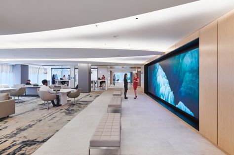 Cushman and Wakefield Offices - Washington DC | Office Snapshots Interesting Lighting, Nyc Office, Healthcare Interior Design, Drywall Ceiling, Multipurpose Hall, Cove Lighting, Office Lounge, Multipurpose Room, Cement Floor