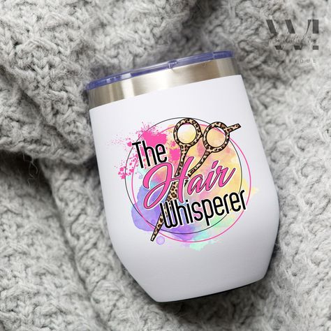 "Welcome to our Etsy listing for the \"Hair Whisperer\" Wine Tumbler! If you're a talented hairstylist or looking for a perfect gift for a hairdresser in your life, this tumbler is just what you need. With its fun and stylish design, it's a great way to celebrate the expertise of hair whisperers everywhere. This wine tumbler is made from high-quality materials to ensure durability and long-lasting use. It features a secure lid that keeps your wine or other favorite beverages safe and prevents any spills or leaks. Sip your favorite wine with confidence, knowing that your tumbler will keep it fresh and secure. The \"Hair Whisperer\" design on this tumbler showcases your hairstyling prowess with pride. Whether you're a cosmetology graduate or a seasoned hairdresser, this tumbler is a perfect Cosmetology Graduation, Gift For Hair Stylist, Feminist Tote Bag, Diy Mug Designs, Cosmetologist Gifts, Tumblr Cup, Hairdresser Gift, Hair Stylist Gifts, Cosmetology School