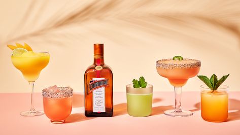 4 Tropical Cocktail Recipes | Cointreau Cocktail Hour Huckleberry Margarita, Tropical Cocktail Garnish, Cointreau Margarita, Pineapple Cocktail Photography, Tropical Cocktail Photography, Guava Margarita, Alcholic Drink Tropical, Tiki Cocktail Photography, Cointreau Cocktails