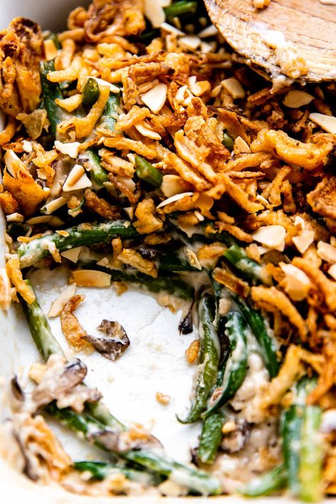 This Make Ahead Green Bean Casserole recipe is a homemade version of the classic side dish that you can prep up to 2 days in advance! Stir fresh green beans into a béchamel-style creamy mushroom sauce & top with French fried onions & slivered almonds. So easy, & no mushroom soup cans! A made from scratch holiday staple, perfect for Thanksgiving, Friendsgiving, or any other special occasion meal! #greenbeancasserole #makeaheadgreenbeancasserole #thanksgivingrecipes #thanksgivingsidedishes Make Ahead Green Bean Casserole, Thanksgiving Green Beans, Fresh Green Bean Casserole, Green Beans With Almonds, Green Bean Casserole Recipe, Classic Green Bean Casserole, Food Fall, Mushroom Casserole, Greenbean Casserole Recipe