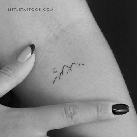 Set of three minimalist mountain and tiny crescent moon temporary tattoos. Dusk or dawn, the mountains are a magical place. They generate a sense of wonder and a number of spiritual experiences. In fact, being in the mountains takes you away from the hustle and bustle of everyday life and closer to the peace and quiet in the heavens. If you’re a nature lover who is and always will be in awe of the majesty of the mountains then our mountain temporary tattoo is the perfect piece for you. Created u Tiny Tattoo Mountain, Mountains And Moon Tattoo, Mountain Tattoo Fine Line, Mini Mountain Tattoo, Mountain And Moon Tattoo, Mountain Tattoo Minimalist, Tiny Mountain Tattoo, Minimal Mountain Tattoo, Mountain Outline Tattoo