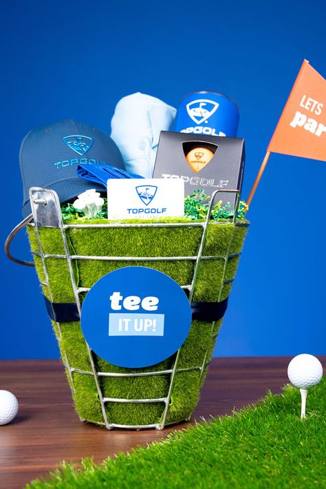 Perfect for the golf lover in your life, whip up a “Tee It Up” Golf Gift Basket with Evite And Topgolf! Top Golf Gift Basket, Golf Baskets Ideas, Golf Themed Basket, Golf Easter Basket Ideas, Golf Basket Ideas Silent Auction, Golf Theme Gift Basket, Golf Outing Raffle Basket Ideas, Golf Raffle Basket Ideas, Golf Basket Ideas For Men