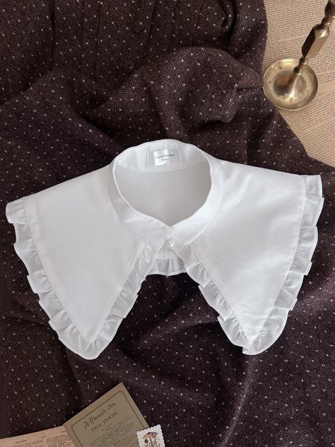 I'm glad to introduce you: Grette - the Peter Pan detachable collar with ruffles and pearl button on the front. The size depends on the circumference of the neck: S-34-35cm M-36-37cm L-37-38cm The collar wide including ruffles is 15cm care recommendation: Hand wash in warm water and dry flat. Low temperature iron. If you have any questions please don't hesitate to contact me. The item is ready to ship in 1-3 days after payment. Handmade with love in the USA. worldwide shipping. Compostable package🌱 Outfit Inso, Bib Collar, Neck Accessories, Detachable Collar, Fashion Project, Designs For Dresses, Historical Costume, Puffy Sleeves, Pan Collar