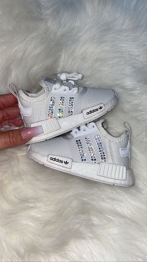 Toddler adidas NMD with bling 💎 Color: White Size: 4c-10c Crystal color: clear diamonds or baby pink Option will be available under the drop box Crystals: 100% authentic genuine Swarvoski crystals adhered with a strong gem adhesive Care: Hand wash only - or use a magic eraser Check out all my other items :) Luxury Baby Clothes, Toddler Adidas, Custom Adidas, Girls Shoes Sneakers, Nike Shoes Girls, Toddler Sneakers, Cute Nike Shoes, Drop Box