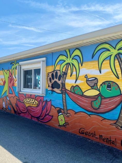 Restaurants and cafés across Flagler Beach have partnered with local artists to splash their exteriors with murals like the ice cream-themed mural at Surfside Shakes, and the Insta-worthy “Raining Donuts” mural outside Swillerbees Craft Donuts and Coffee Bar. Their close proximity makes it easy to complete a mural crawl in the heart of Flagler Beach and admire art while enjoying some of our best food and drinks. Check out this map to plan your walk. Tropical Graffiti Art, Beach Murals Outdoor, Ice Cream Murals, Summer Mural Ideas, Beach Mural Painted Wall, Poolside Mural, Beach Mural Painted, Outside Murals, Wall Painting Outdoor