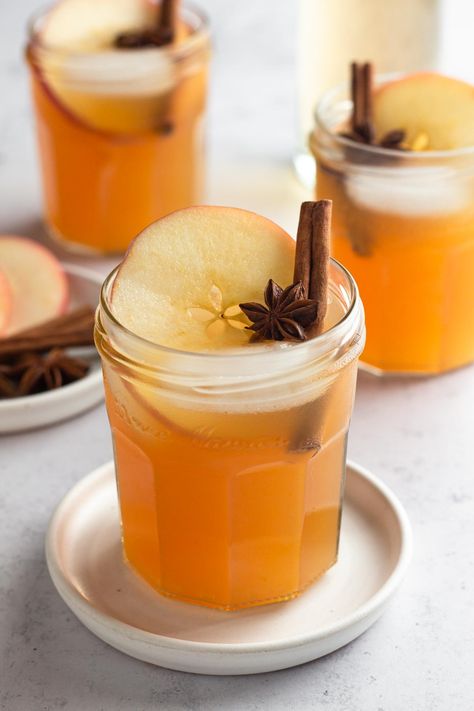 This sparkling apple cider punch recipe - made with cider, ginger ale, and pineapple juice - is full of fall flavor yet unexpectedly light and refreshing. Spike it with spiced rum for an easy cocktail or opt for a non-alcoholic mocktail - it's delicious either way! This simple fall cocktail is perfect for a crowd but can easily be scaled down for a cozy night in. Sparkling Apple Cider Punch, Apple Cider Punch Recipes, Fruity Drink Recipes, Cider Punch, Sparkling Apple Cider, Cranberry Walnut Bread, Apple Cider Punch, Thanksgiving Cocktail, Apple Cider Cocktail