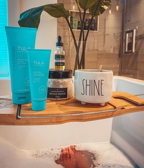 Angie Bellemare on Instagram: “I only share the stuff I’m OBSESSED with. My BATH 🛁 & POST BATH routine @tula cleanser and scrub With some @confectionerysoapsco…” Tula Cleanser, Angie Bellemare, Bath Routine, Bath Caddy, Scrubs, Bath, On Instagram, Instagram