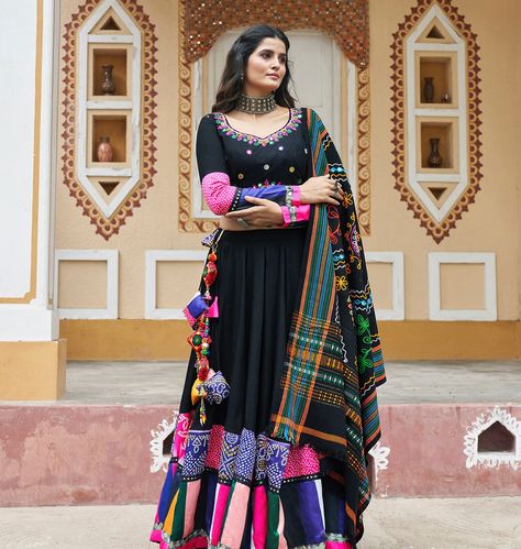 Experience the Navratri vibe with our black rayon embroidery with mirror work 8.5 meter lehenga, teamed with luxurious blouse and print with embroidery dupatta ✨⭐️ SHOP NOW 🛍️ gotifab.com [lehengacholi, garba outfits, navratri lehengas, navratri collection,navratri chaniya choli,navratri collection ] #lehengacholi #navratrilehenga #navratricollection #navratri #navratrichaniyacholi #garbaoutfit Choli For Navratri, Anarkali Lehenga Gowns, Chania Choli, Garba Outfit, Embroidery Mirror Work, Navratri Lehenga, Garba Dress, Embroidery Mirror, Black Lehenga