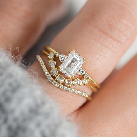 Two words we love: are shine and stunning. That's how we'd describe the beautiful emerald cut diamond engagement ring. Emerald Engagement Ring With Band Gold, Emerald Cut Engagement And Wedding Ring Sets, Emerald Cut Solitaire Engagement Ring With Wedding Band, Diamond Centerpiece, Handcrafted Engagement Ring, Melanie Casey, Timeless Engagement Ring, Emerald Cut Diamond Engagement Ring, Emerald Cut Engagement