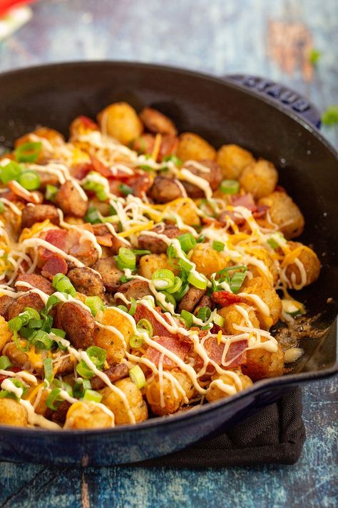 Easy Loaded Tater Tots #tatertot #bacon #sausage #mayonnaise #gameday #superbowl #cheese #tabasco #breakfast #breakfastrecipe #appetizer #appetizerrecipe | The Missing Lokness Breakfast Tater Tots, Sausage Gravy Tater Tots, Breakfast Casserole Tator Tots Sausage, Bacon Tater Tots Appetizers, Cajun Tater Tots, Sausage Tatertot Casserole Breakfast, Loaded Tater Tots, Ham Breakfast Casserole, Last Minute Appetizer