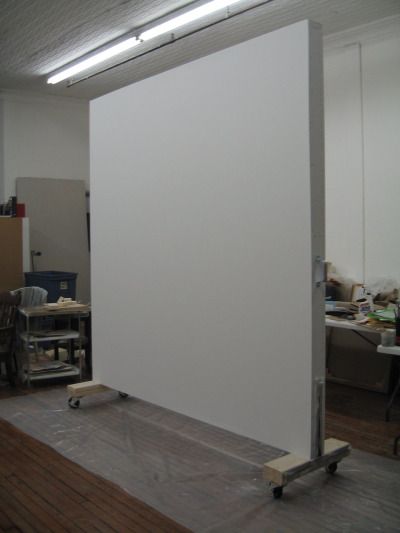 Rolling wall created for a painter in SoHo, NY as a studio divider and a display surface.  Welded metal brackets, 2x4’s, sheetrock, and castors. (3/26/2009) Moveable Wall, Office Room Dividers, Mobile Whiteboard, Fabric Room Dividers, Bamboo Room Divider, Movable Walls, Wooden Room Dividers, Studio Apartment Divider, Portable Walls