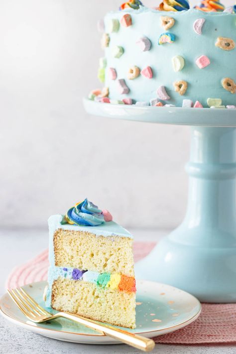 You'll feel lucky with your first bite of Lucky Charms cereal milk cake! This delicious vanilla cake, made with cereal milk in the batter and topped with vanilla frosting is sure to please your inner child. This recipe includes a quick tutorial on piping a buttercream rainbow *inside* your cake for a fun unexpected surprise. Cereal Milk Cake, Buttercream Rainbow, Cereal Cake, Lucky Charms Cake, Marshmallow Cereal, Lucky Charms Cereal, Pinata Cake, Cereal Milk, Milk Cake