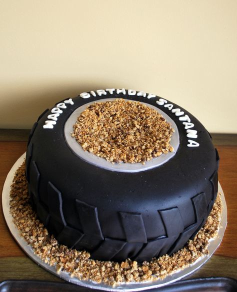 Monster truck tire cake - 12" cake with black fondant.  I used cookie crumbs for the dirt. Monster Truck Birthday Cake, Truck Cookies, Monster Truck Cookies, Monster Jam Birthday Party, Man Cakes, Tire Cake, Monster Jam Birthday, Truck Birthday Cakes, 12 Cake