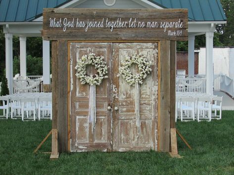 Rustic Wedding Doors rent @ Rusted Root Rentals. Amazing entrance setup of wedding doors beautiful entryway for a rustic, outdoor wedding, vintage doors, rustic wedding. vintage wedding. outdoor weddings. wedding ideas. made from old barn wood with verse, what God has joined together let no man separate. Mark 10.9 #rustedrootrentals Old Doors For Wedding Entrance, Doors For Outside Wedding Entrance, Outdoor Wedding Entryway, Wedding Door Decorations Entrance, Outdoor Wedding Doors Entrance, Doors For Wedding Entrance, Rustic Wedding Doors, Wedding Doors Entrance Outdoor Ceremony, Hayfield Wedding