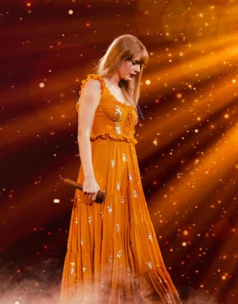 Taylor Swift at The Eras Tour #taylorswift #theerastour Taylor Swift Orange, Eras Tour Evermore, Colourful Things, Blonde With Blue Eyes, Swift Tour, Taylor Swift The Eras Tour, Taylor Swift Outfits, Orange Aesthetic, Red Taylor