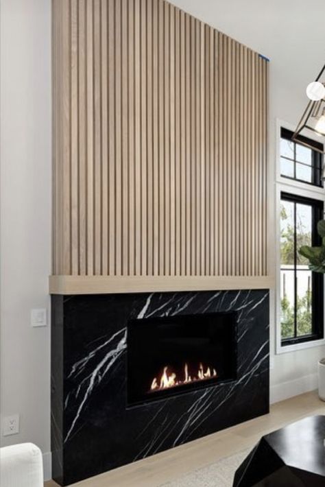 Fireplace With Bar On Side, Fluted Wood Fireplace Wall, Ribbon Tile Fireplace, Dark Fireplace Light Walls, Mid Century Fireplace Ideas, Pole Wrap Fireplace, Two Tone Fireplace, Slat Fireplace, Wood Panel Fireplace